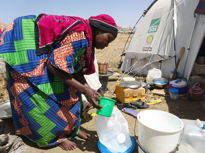 Woman producing clean water.