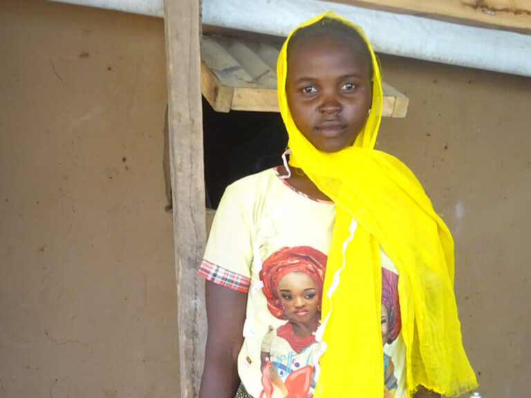 A girl with a bright yellow scarf in Cameroon