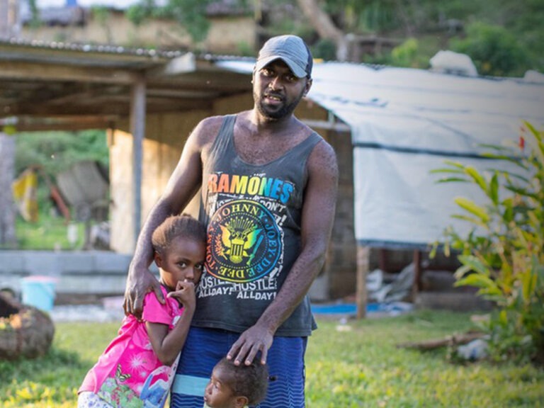 A man holding his daughters