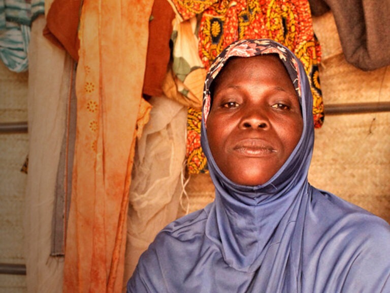 A woman wearing purple clothes