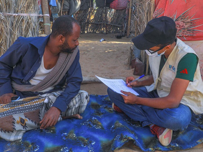 2 men sat down talking