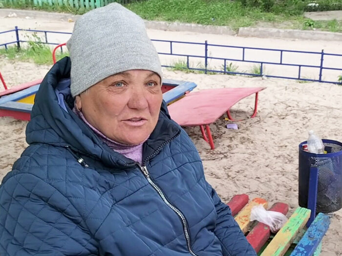 A woman wearing a winter coat and a beanie.