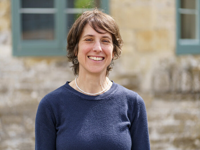 Woman standing in front of a wall