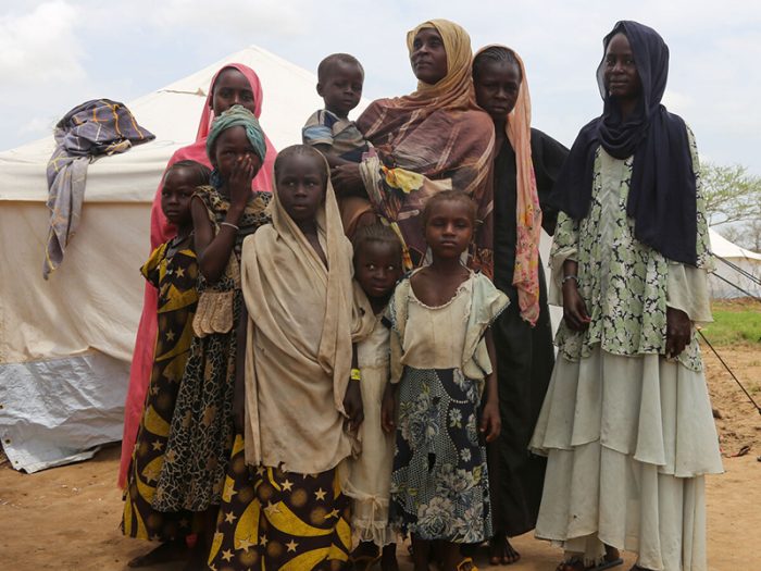Woman and children next to a tent in Chad