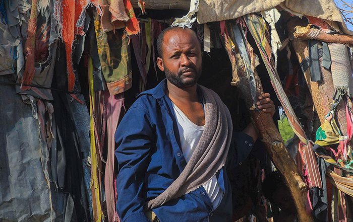 Man standing outside a shelter in Yemen