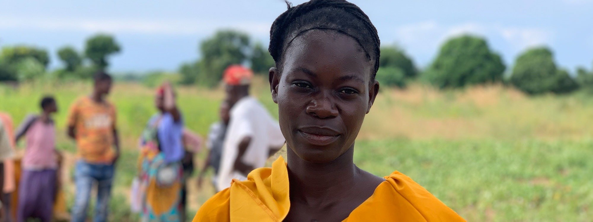 Malawian woman dressed in orange
