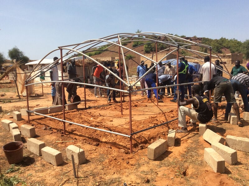 Building tents in a camp.