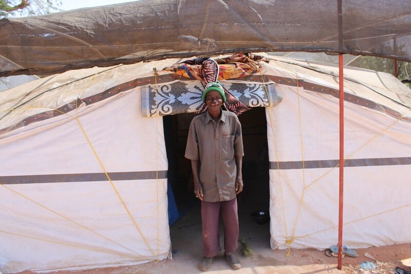 A man outside the Sahel tent.