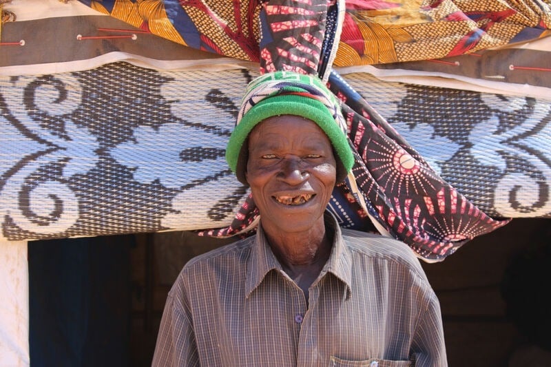 A man outside a Sahel tent.