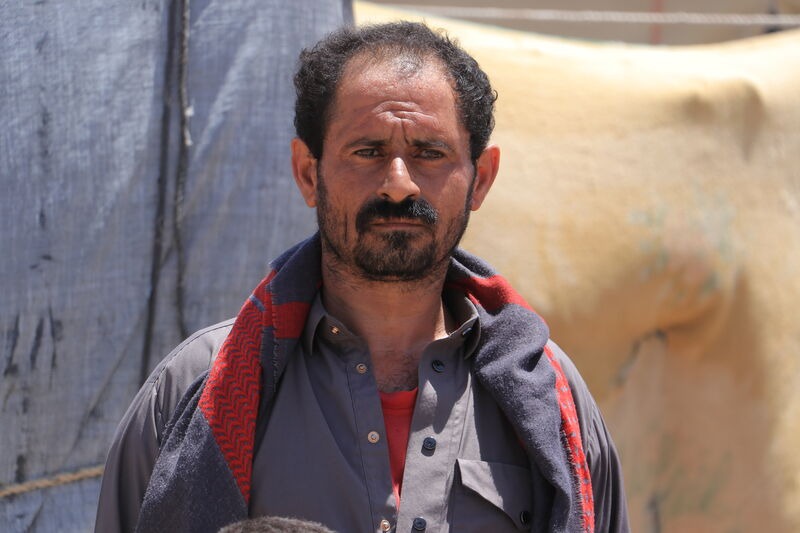 A man outside an emergency shelter.
