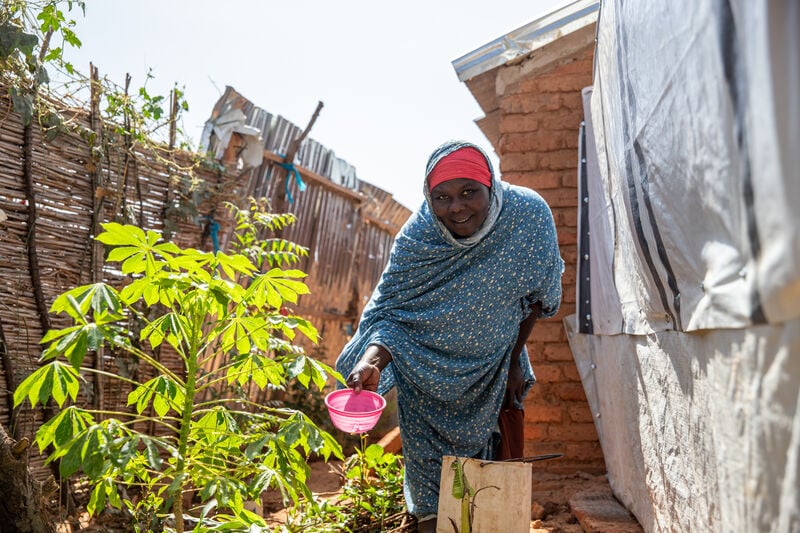 A woman watering plants.