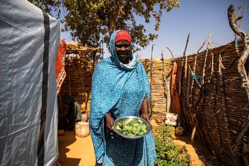 A woman with vegetables.